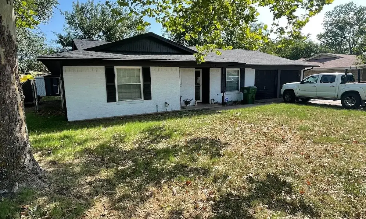 Professional roofing crew working on a residential roof in Fresno